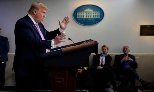 President Trump at a COVID-19 briefing with Anthony Fauci and Deborah Birx in the background
